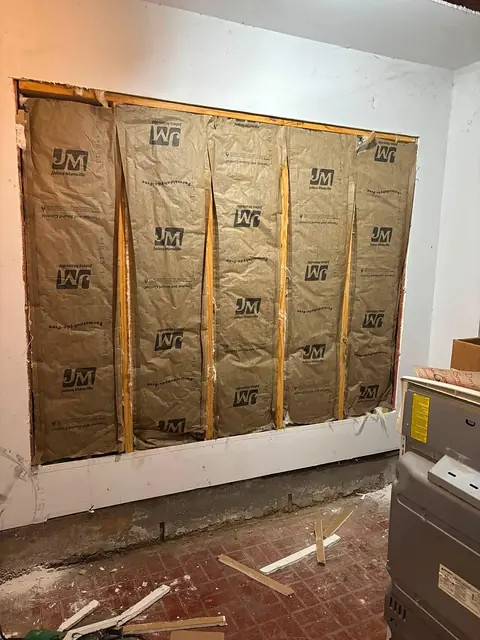 Newly framed wall section filled with insulation batts